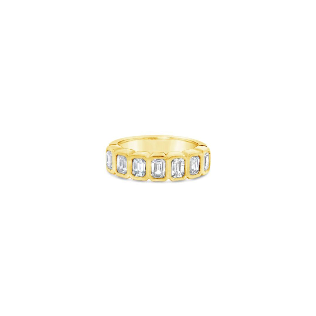 18ct yellow gold diamond ring featuring seven emerald cut diamonds in a straight row bezel setting across the top.