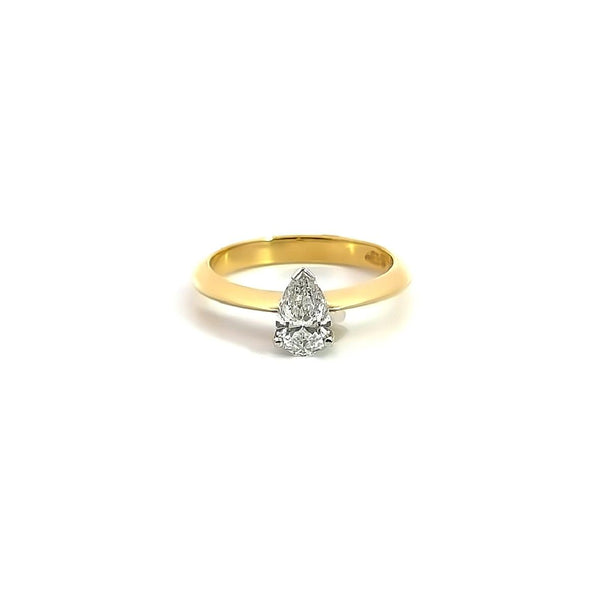 18ct yellow and white gold pear shaped solitaire diamond ring with claw and V-cap setting and French curve shoulders.