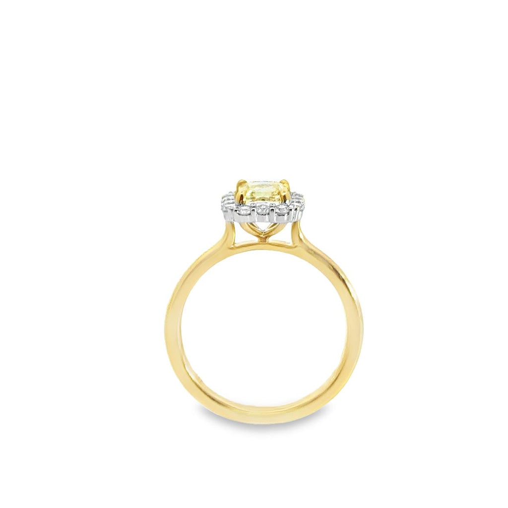 Two-tone 18ct yellow and white gold ring featuring a 1.01ct Fancy Intense Yellow radiant cut diamond with a white diamond cluster surround.