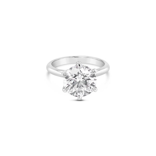 Platinum solitaire diamond ring featuring a 3.01ct round brilliant cut diamond in a six-claw setting.