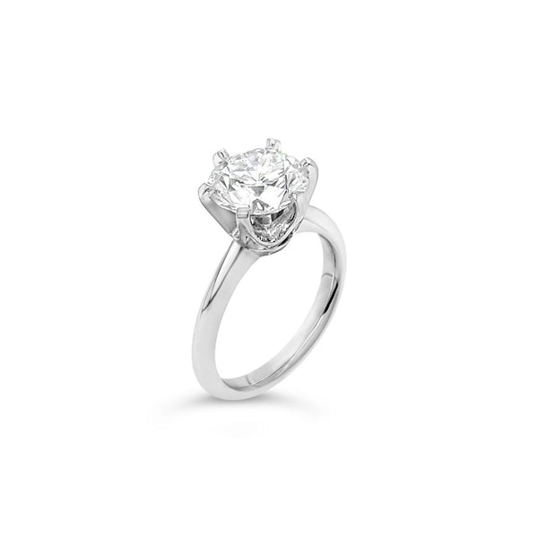 Platinum solitaire diamond ring featuring a 3.01ct round brilliant cut diamond in a six-claw setting.