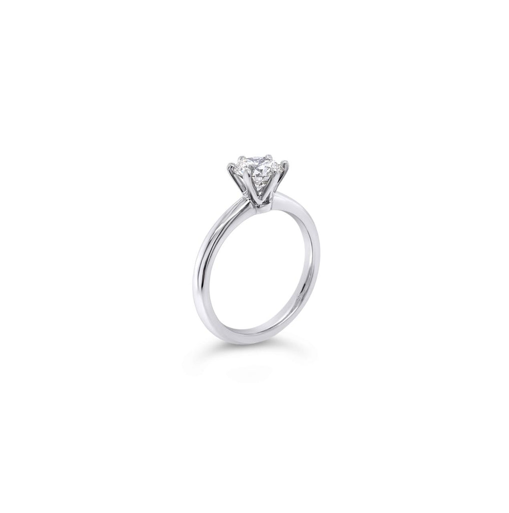 Platinum solitaire diamond ring featuring a 1.06ct round brilliant cut diamond in a six-claw setting.
