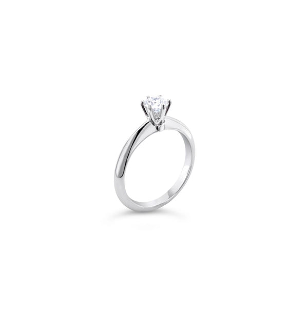 Platinum round brilliant cut 0.50ct solitaire diamond ring with six-claw setting and knife-edge shoulders.
