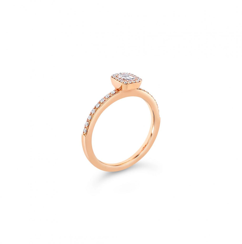 18ct rose gold emerald cut diamond halo ring with diamond-set shoulders.