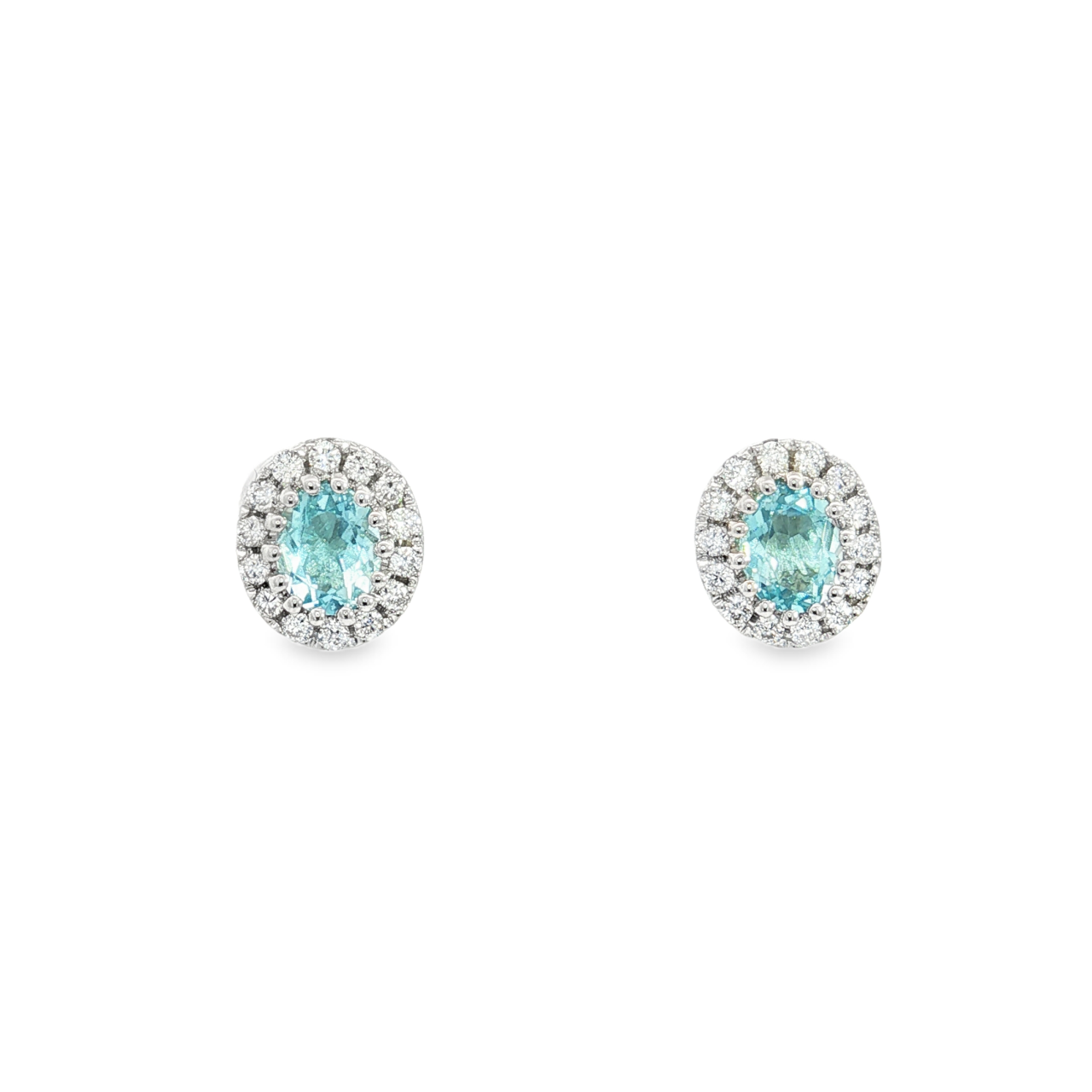 Elegant 18ct white gold aquamarine and diamond halo earrings by James Thredgold Jeweller.