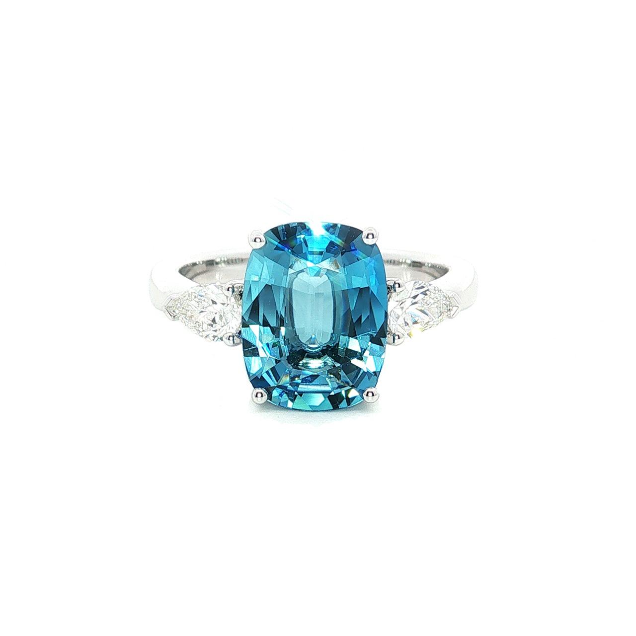 18ct white gold aquamarine ring with pear cut diamond side stones