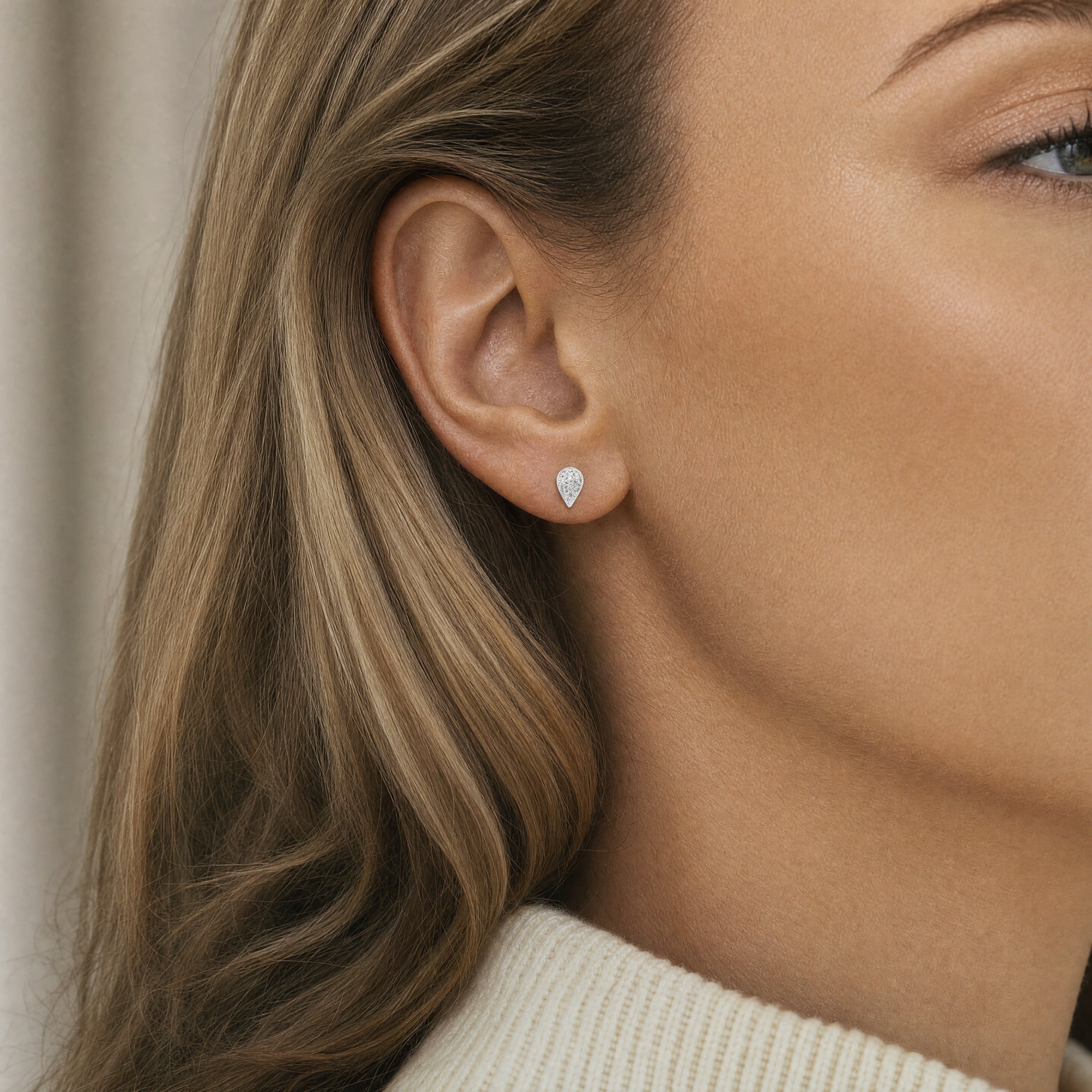 18ct white gold puff pear stud earrings with 18 natural round brilliant cut diamonds in pavé setting 0.18ct
