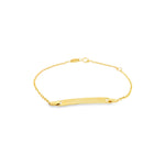 18ct yellow gold baby ID bracelet featuring a fine trace link chain and polished nameplate suitable for engraving.