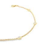 18ct yellow gold trace link bracelet with five bezel-set natural round brilliant cut diamonds