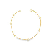 18ct yellow gold trace link bracelet with five bezel-set natural round brilliant cut diamonds