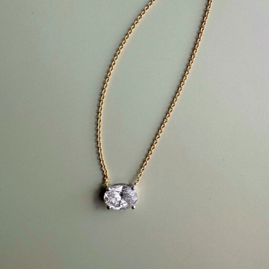 18ct yellow and white gold east-west necklet with 1.01ct natural oval brilliant cut diamond