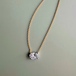 18ct yellow and white gold east-west necklet with 1.01ct natural oval brilliant cut diamond