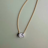 18ct yellow and white gold east-west necklet with 1.01ct natural oval brilliant cut diamond