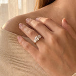 18ct yellow and white gold three stone diamond ring with 1.37ct centre diamond and two round brilliant side diamonds.
