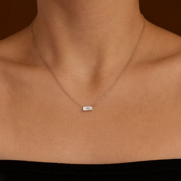 18ct white gold necklet with bar-set baguette cut diamond on fine trace link chain by James Thredgold Jeweller.