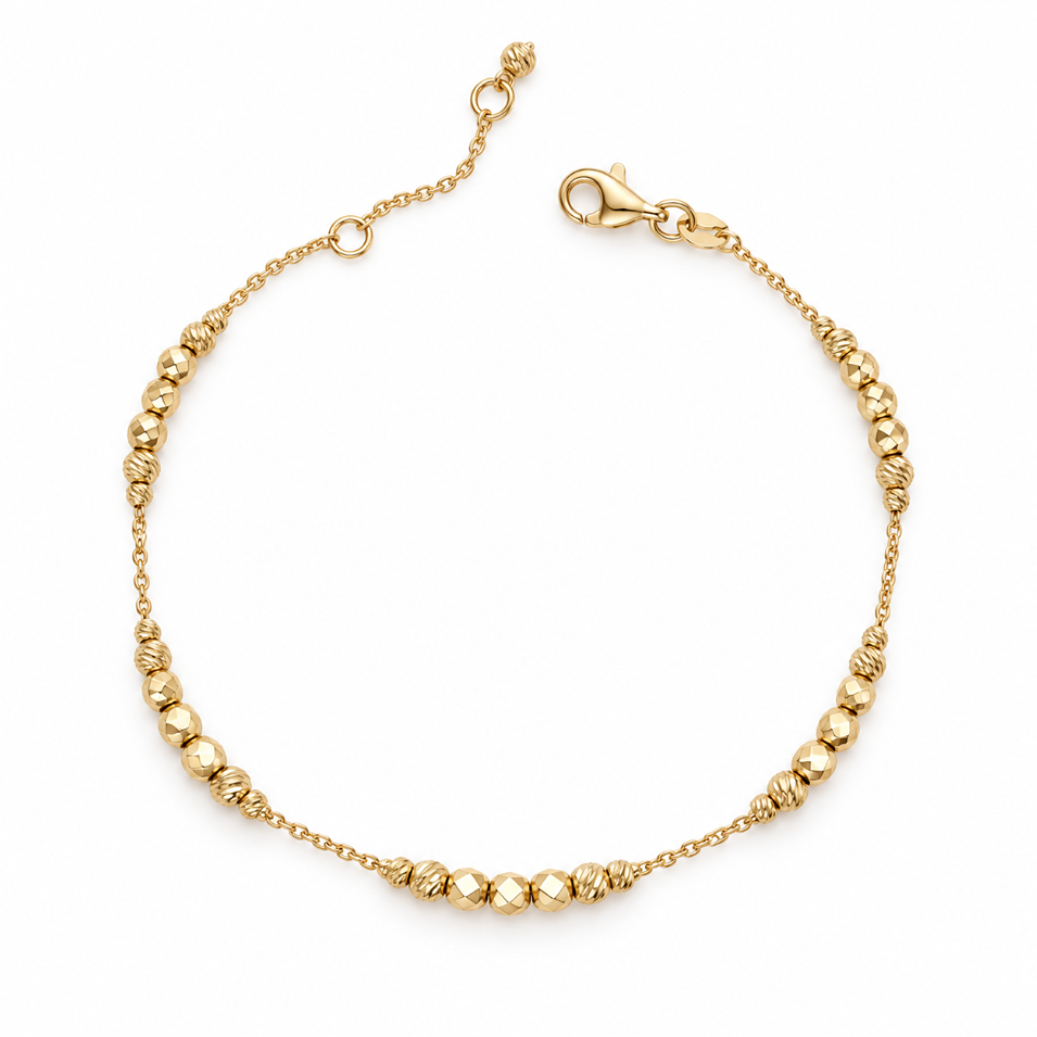 9ct yellow gold trace link bracelet with graduating facetted ball beads, textured gold accents and trigger clasp