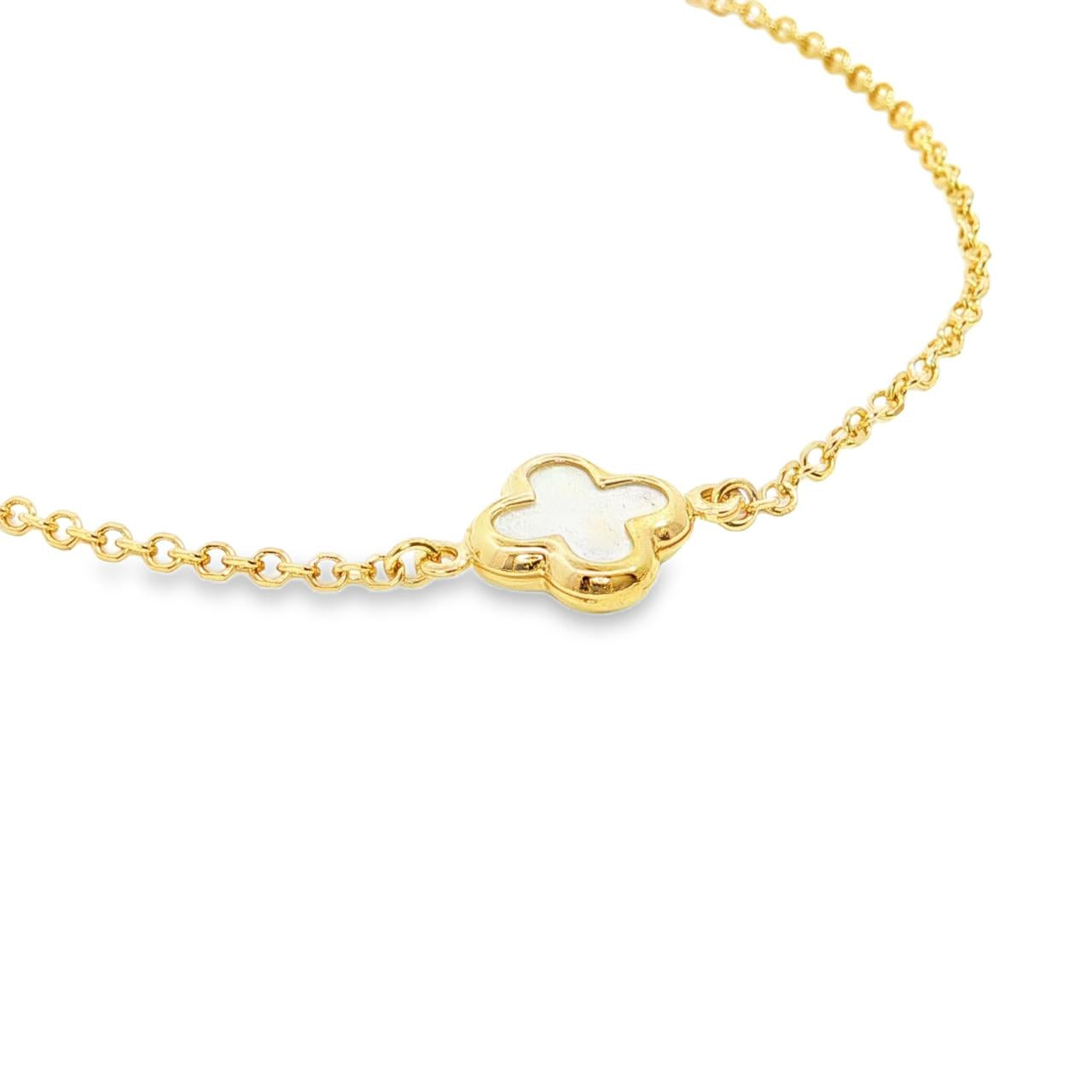 9ct yellow gold trace link bracelet with small mother of pearl clover centre and bolt ring clasp