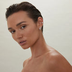 Sterling silver double-strand huggie earrings with polished crossover X design.