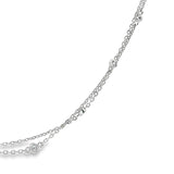 Platinum double strand diamond station necklet with twelve bezel set natural round brilliant cut diamonds on fine trace chains, 40cm long.