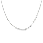 Platinum double strand diamond station necklet with twelve bezel set natural round brilliant cut diamonds on fine trace chains, 40cm long.