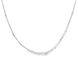 Platinum double strand diamond station necklet with twelve bezel set natural round brilliant cut diamonds on fine trace chains, 40cm long.