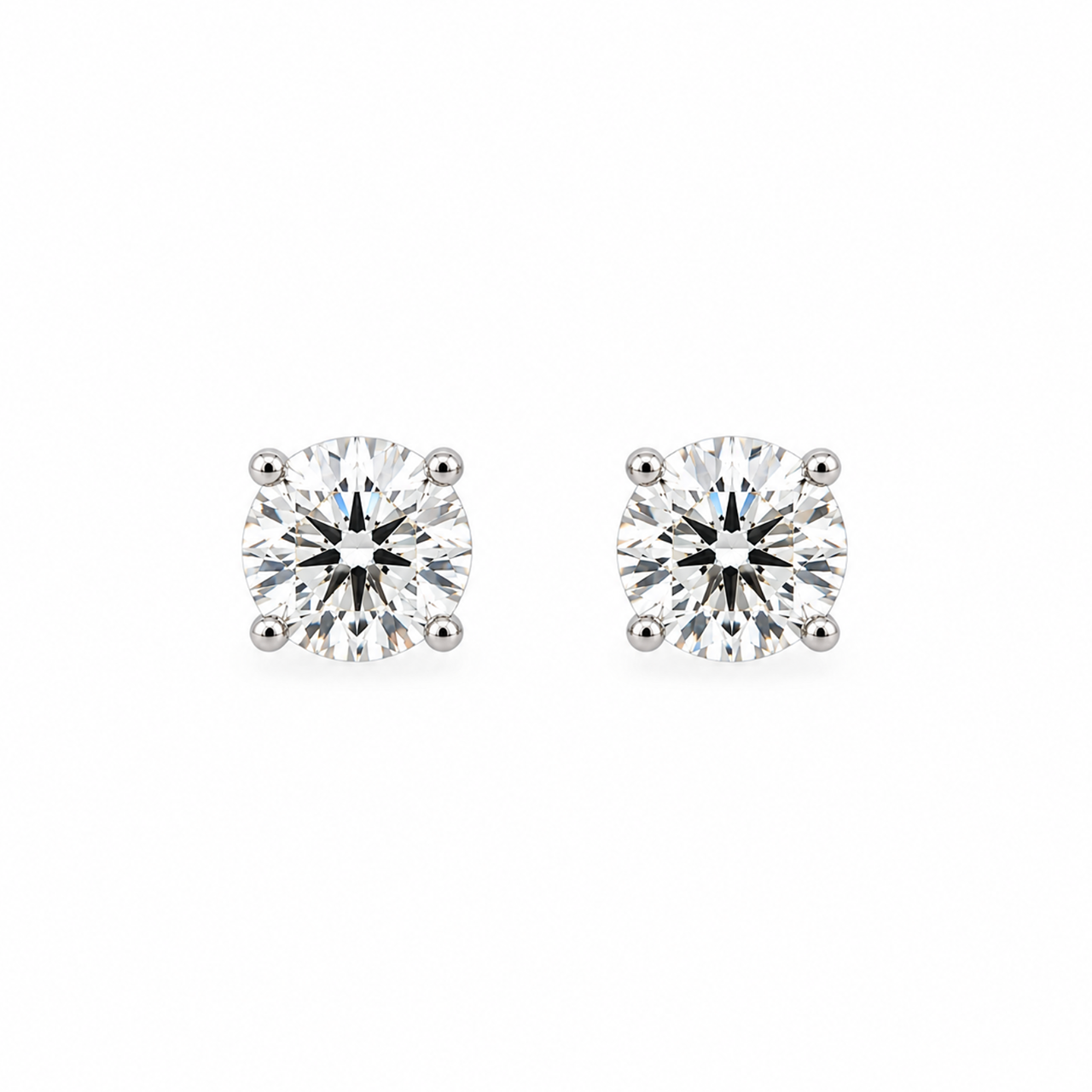 18ct white gold diamond stud earrings featuring two round brilliant cut diamonds totalling 2.48ct, with four-claw settings and butterfly fittings.