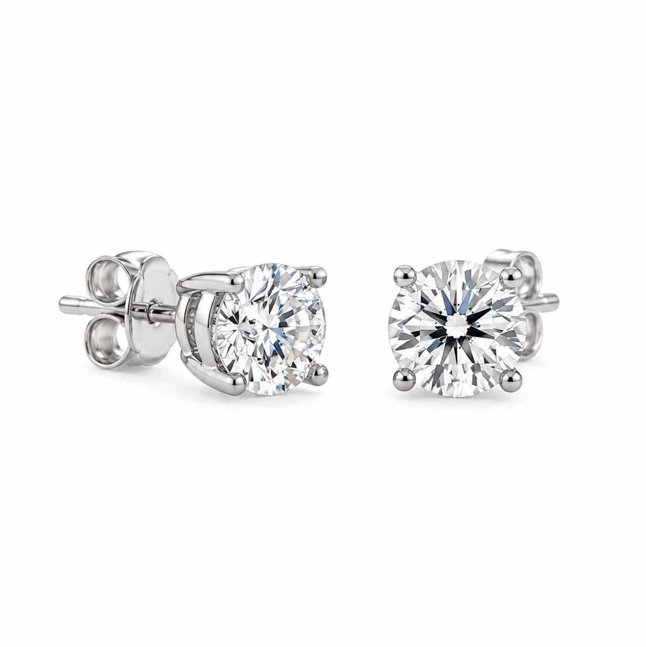 18ct white gold diamond stud earrings featuring two round brilliant cut diamonds totalling 2.48ct, with four-claw settings and butterfly fittings.
