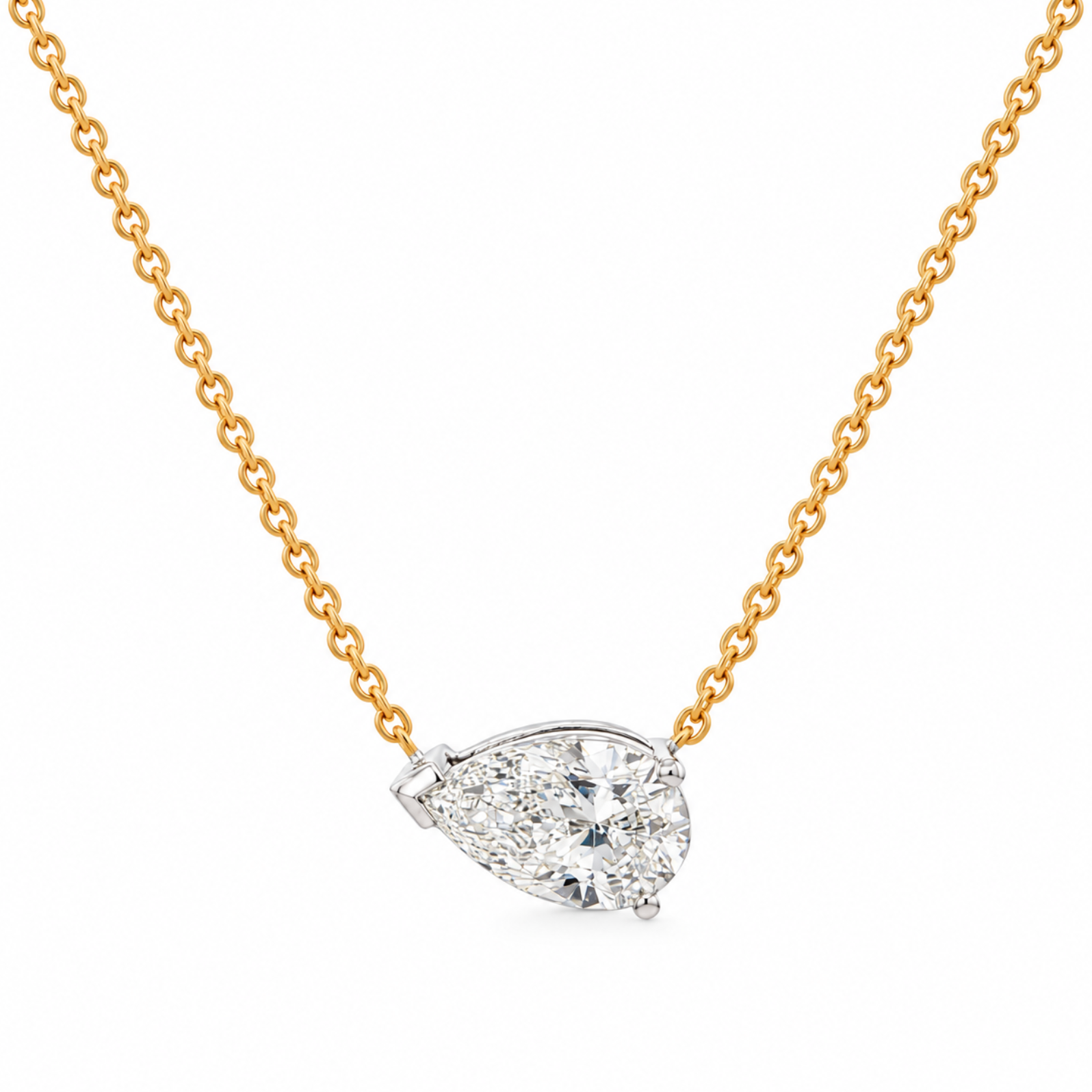 A pear-cut diamond pendant necklace on a gold chain, set against a clean white background.