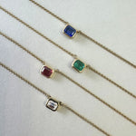 18ct yellow gold necklace with emerald cut sapphire set horizontally in bezel