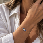 9ct yellow gold Evil Eye cubic zirconia bracelet worn on the wrist.