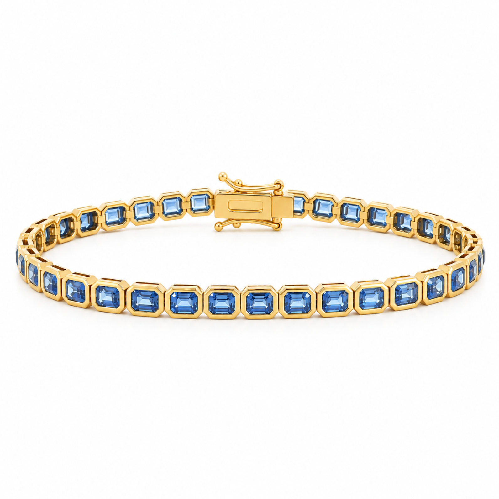 A yellow gold tennis bracelet featuring a row of emerald-cut sapphires, displayed on a clean white background.