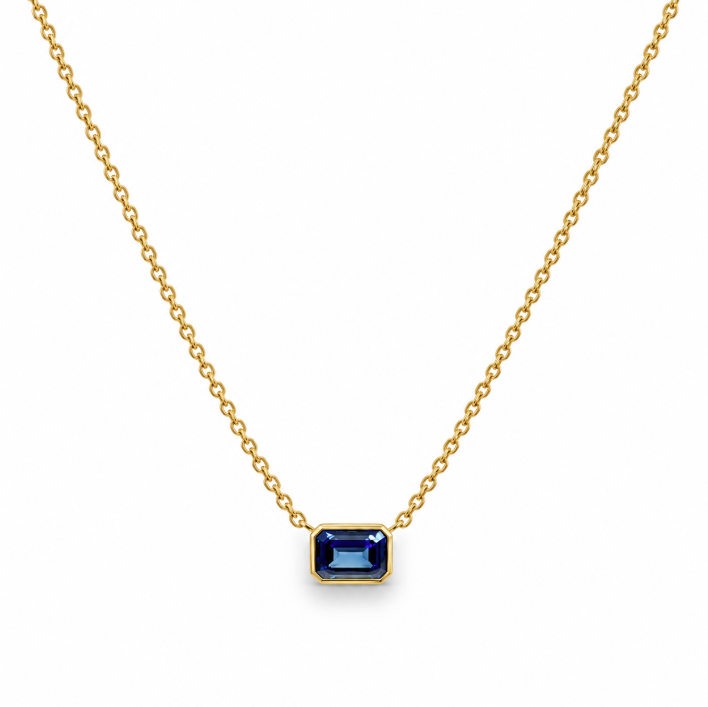 18ct yellow gold necklace with emerald cut sapphire set horizontally in bezel