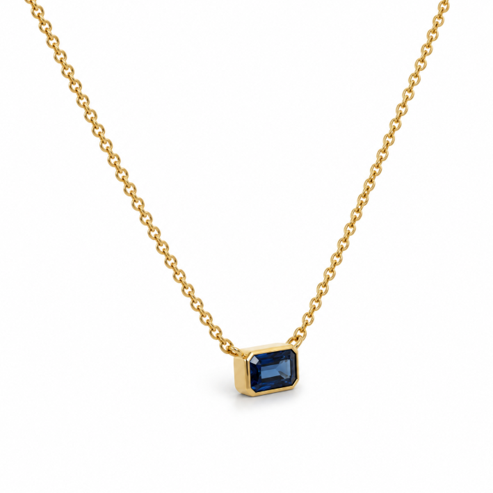 18ct yellow gold necklace with emerald cut sapphire set horizontally in bezel