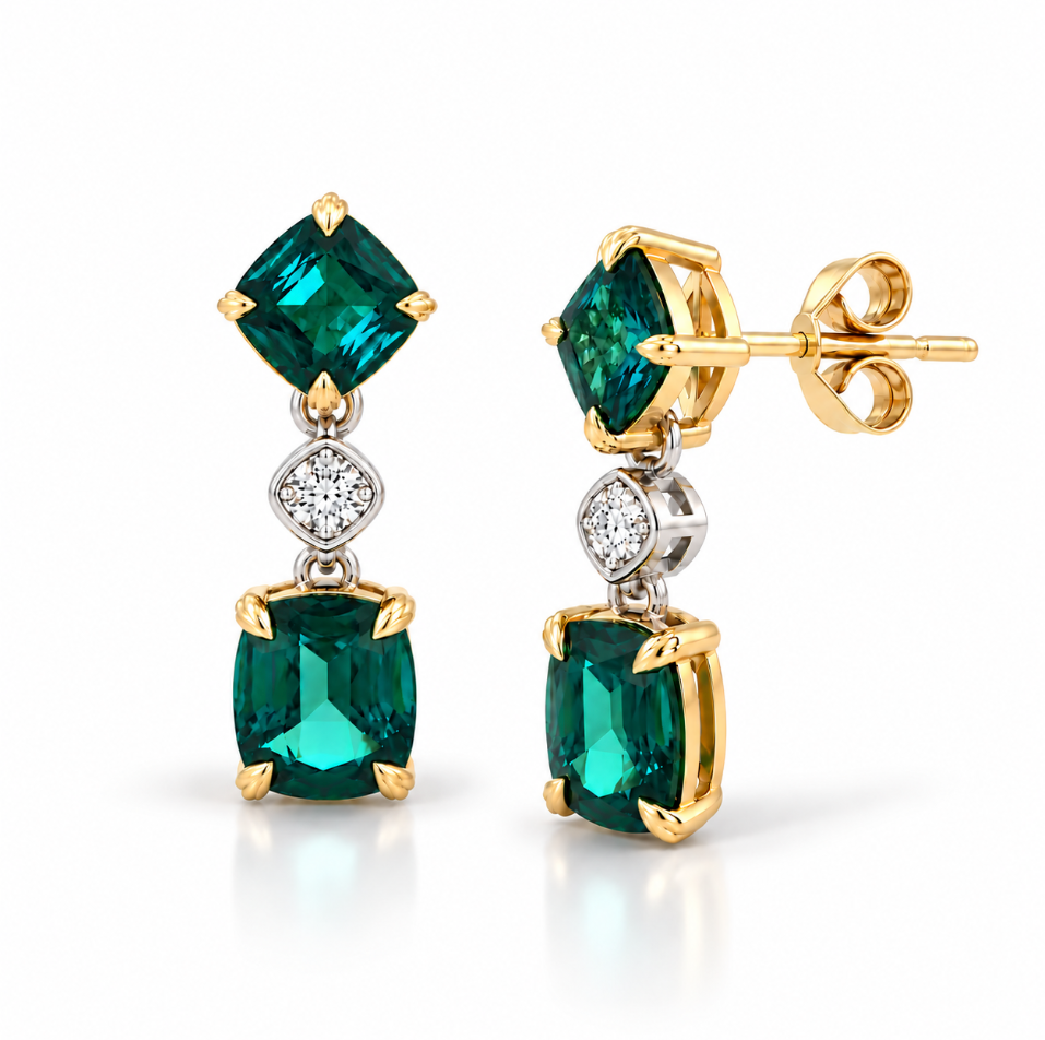 A pair of gold drop earrings featuring square-cut emerald-cut green gemstones and a small round diamond in the center, set against a clean white background.