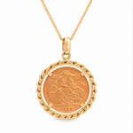 A gold pendant necklace featuring a circular Saint George coin surrounded by a twisted rope border, suspended from a gold chain on a white background.