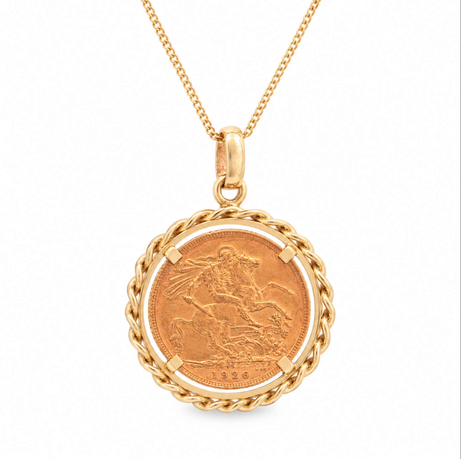 A gold pendant necklace featuring a circular Saint George coin surrounded by a twisted rope border, suspended from a gold chain on a white background.