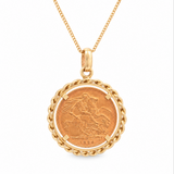 A gold pendant necklace featuring a circular Saint George coin surrounded by a twisted rope border, suspended from a gold chain on a white background.