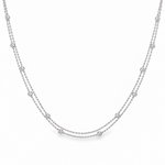 Platinum double strand diamond station necklet with twelve bezel set natural round brilliant cut diamonds on fine trace chains, 40cm long.