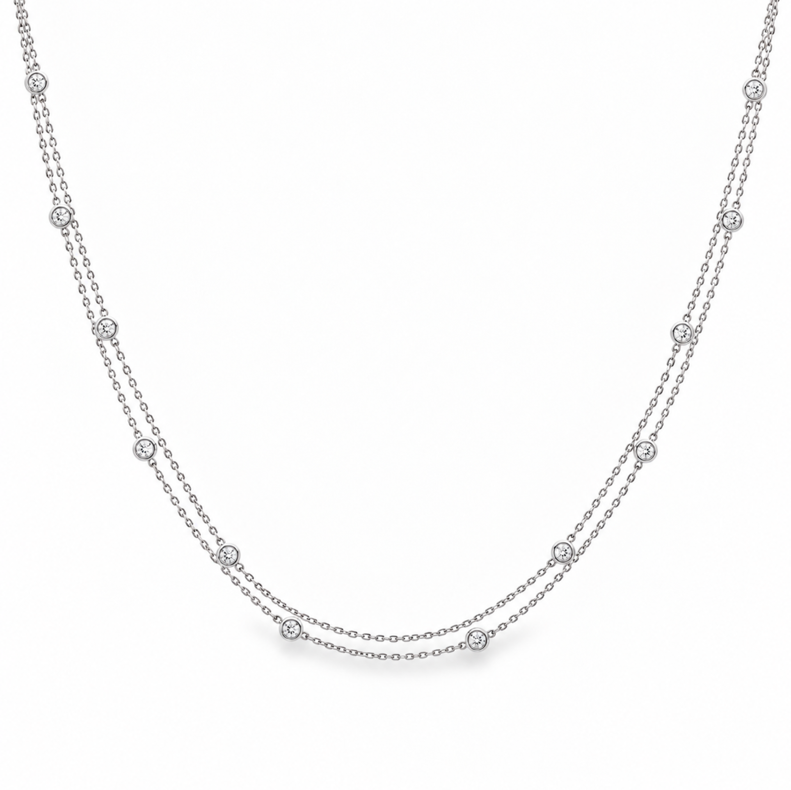 Platinum double strand diamond station necklet with twelve bezel set natural round brilliant cut diamonds on fine trace chains, 40cm long.