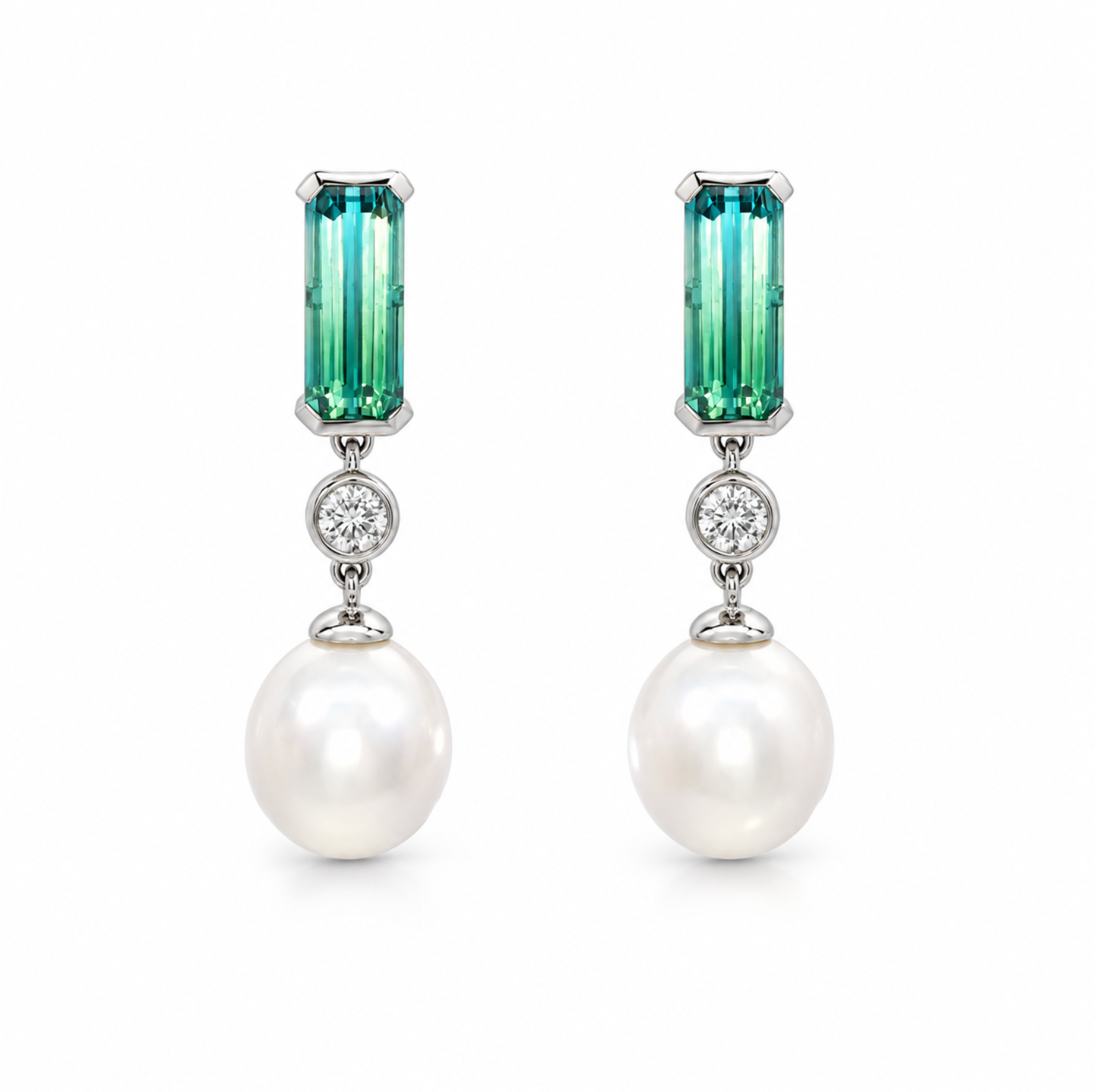 18ct white gold drop earrings featuring oval South Sea pearls, emerald cut ombré bi-colour tourmalines and bezel set natural round brilliant cut diamonds.