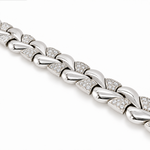 A close-up of a white gold chain link bracelet with pavé-set clear stones, shown diagonally on a clean white background.