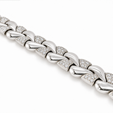 A close-up of a white gold chain link bracelet with pavé-set clear stones, shown diagonally on a clean white background.