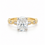 2.50ct oval diamond engagement ring in 18ct yellow and white gold with four-claw setting and alternating marquise-shaped and round diamond shoulders.