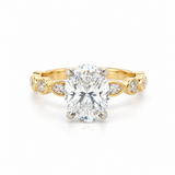 2.50ct oval diamond engagement ring in 18ct yellow and white gold with four-claw setting and alternating marquise-shaped and round diamond shoulders.