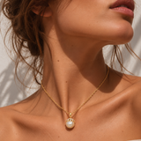 18ct yellow gold South Sea pearl and diamond pendant featuring a 14mm light golden pearl with a sculptural pavé diamond-set cap.
