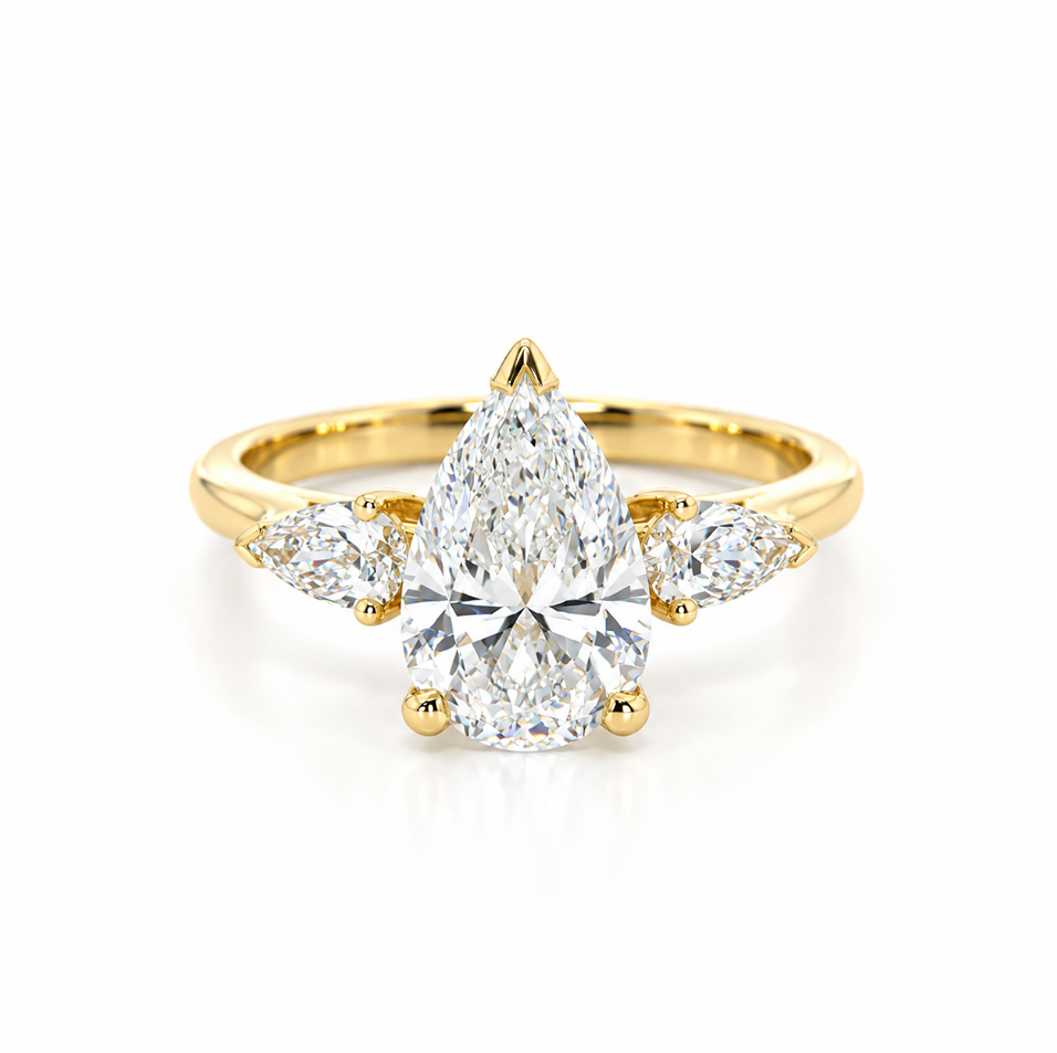 Three-stone pear diamond engagement ring in 18ct yellow gold with vertically set centre diamond and horizontal pear-shaped side stones.