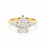 Three-stone pear diamond engagement ring in 18ct yellow gold with vertically set centre diamond and horizontal pear-shaped side stones.