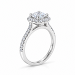 18ct white gold diamond halo ring featuring a 1.01ct round brilliant cut centre diamond with a circular diamond halo and claw-set shoulders.