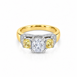 18ct yellow and white gold diamond ring featuring a 0.91ct cushion cut centre diamond with Fancy Yellow side diamonds and round diamond accents.