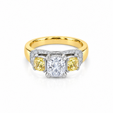 18ct yellow and white gold diamond ring featuring a 0.91ct cushion cut centre diamond with Fancy Yellow side diamonds and round diamond accents.